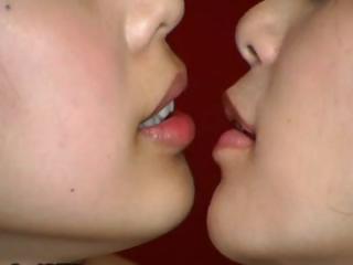Several Japanese girls are carrying out some strange kissing with a mouth send back
